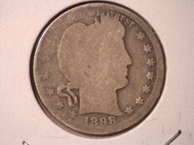 1898 Barber Half Dollar off-center strike error showing portion of blank planchet alongside properly struck design elements
